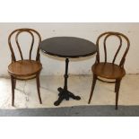 A circular wooden topped cast iron table, together with two Bentwood chairs, diameter 68cm, height