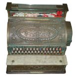 An antique brass mounted cash register manufactured by National Cash Register Co, Dayton, Ohio, U.