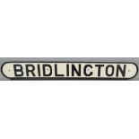 A reproduction plastic seat sign 'Bridlington', 10 x 76cm.