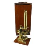 A Victorian monocular brass microscope, by J.P. Cutts, Sutton & Son, c. 1850 - 1876, with brass