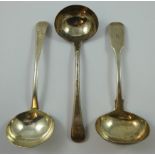 A George III silver pair of Old English pattern gravy ladles, London 1789, crested and a George