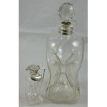 An Edwardian silver and glass whisky decanter, Sheffield 1903, the dimple bottle with silver neck,