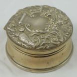 A silver trinket box, Birmingham 1976, the hinged cover with embossed bird and scroll decoration,