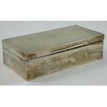 A silver cigarette box, Birmingham 1942, with presentation inscription, cedar wood lined, 18 x 9 x 5