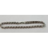 A 9ct white gold and diamond bracelet, set with brilliant cut stones, approximately 050 cts,