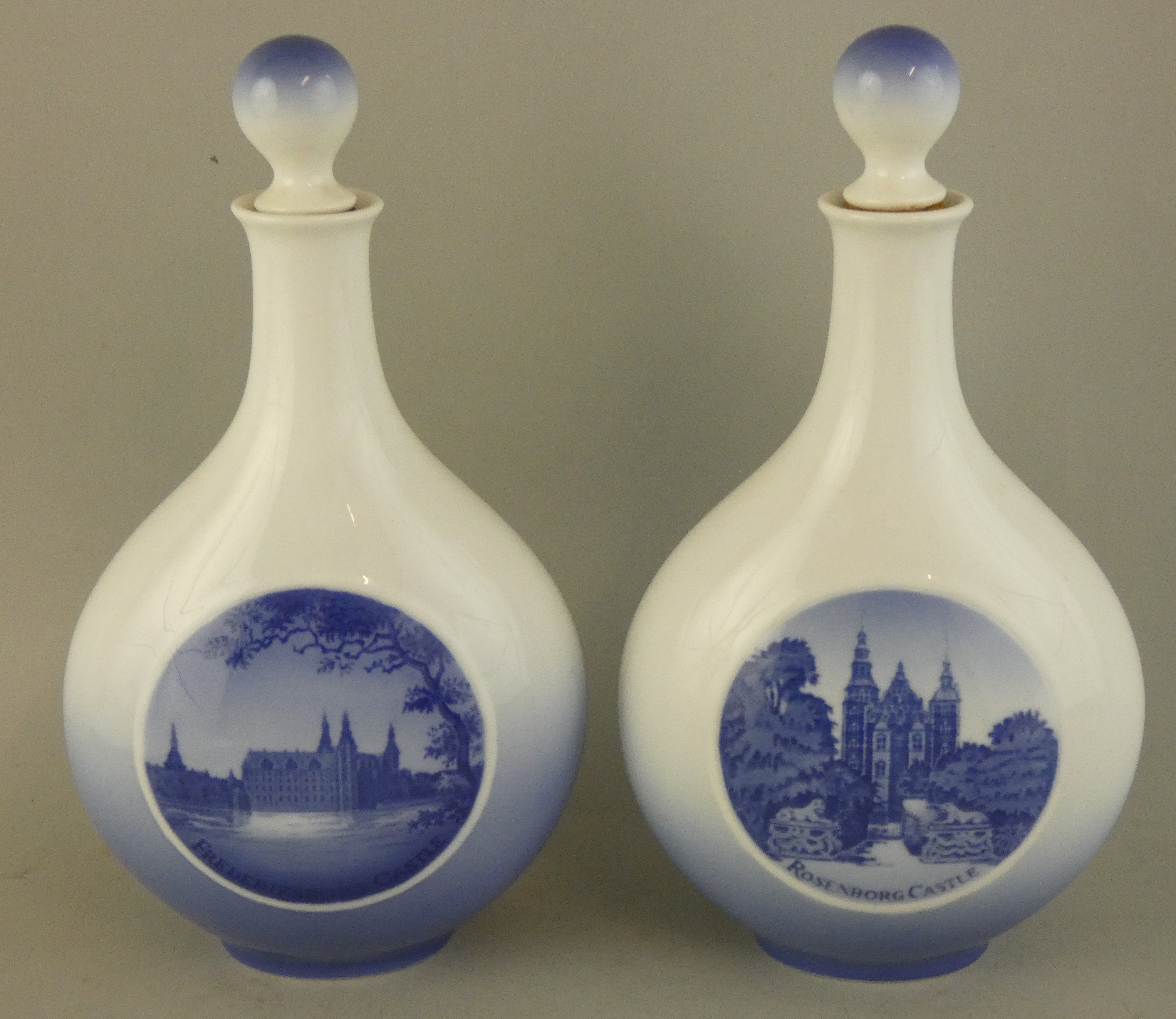 A pair of Royal Copenhagen flasks, depicting Rosenburg Castle, marked to base number Y378 NTX,