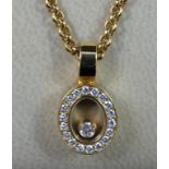 A Chopard Happy Diamond pendant, the oval design, featuring loose diamond to centre, surrounded by a