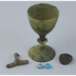 Two Roman glass beads, a bronze goblet, a Roman finger ring, a Roman bow brooch, together with