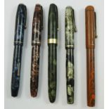 A group of five vintage marbled fountain pens, all with 14ct gold nibs, to include Conway Stewart