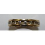 A 9ct gold diamond set eternity ring, channel set with brilliant cut stone, size K 1/2.