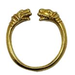 A gold Viking style torque ring, unmarked, with mythological animal head terminals, size R, weight