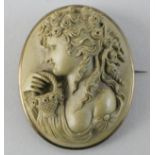 A Victorian lava cameo brooch, depicting Flora with a basket, 4.5 x 4 cm.