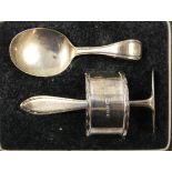 A silver christening set, Birmingham 1932/33, comprising napkin ring, spoon and pusher, weight 1.5