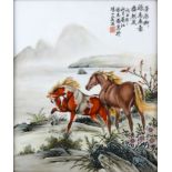 A Chinese porcelain panel, decorated with two horses by a lake, red character mark and