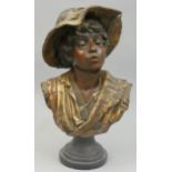 A late 19th century painted plaster bust of a child wearing a hat, height 46 cm.