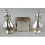 A silver sugar bowl, Birmingham 1937, of rectangular form and a pair of Victorian pepper pots,