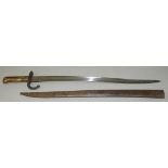 A French Chassepot bayonet, the serpentine fullered blade 57.5cm long marked, St. Etienne Janvier