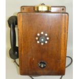 A railway signal line box telephone in mahogany case, with Ericsson bakelite receiver.