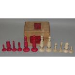A late 19th/early 20th century Cantonese ivory chess set, one side stained red, one knight a
