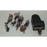 A group of nine lead band member models, together with a lead model of a piano and eight chairs (18)