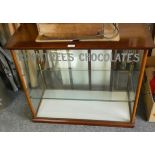 An Edwardian mahogany framed Rowntree’s Chocolate counter top display cabinet, with two shelves,