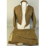 A Blouse Battledress 1949 size 7, dated 1959 and bearing officer cadet epaulets with RMA Sandhurst