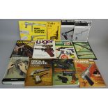 A selection of firearm related books, including Luger by John Walter and Walther P-38 pistol by Maj.