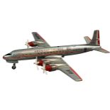 A tinplate battery operated American Airlines Multi-Act DC-7C plane, by Yunezawa of Japan.
