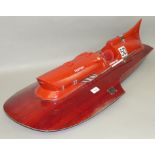 A model of Castoldi's 1953 Ferrari Hydroplane, with planked wooden hull and padded leather set.