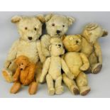 A collection of six early stuffed and playworn teddy bears, to include a Shinder No. 01282 patchwork