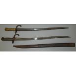 Two French Chassepot bayonets, one missing the scabbard, one marked 1874.
