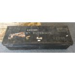 A large black painted metal military foot locker, 108 x 37 x 29cm, the lid stencilled with 135590 WM