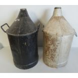 A pair of railway oil cans, one painted black and the other silver with hubcap, height 53cm (2).