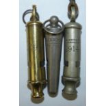 Three Police whistles, a brass international police whistle, a tapered whistle marked Liverpool City