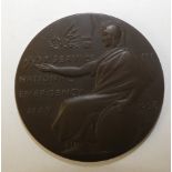 A 50mm diameter bronze medal presented to F. Jones of Holywell in recognition of Service in the