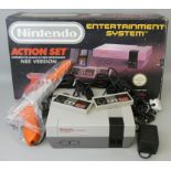 A boxed Nintendo Entertainment System (NES) Action Set, with control deck, two controllers, zapper