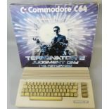 A boxed Commodore C64 'Terminator 2 Judgement Day' computer, with games cartridge 'Modern Music