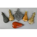Six powder flasks, 2 gilt brass embossed by Hawksley of Sheffield, one red painted steel, one