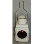 A British Rail white enamel paraffin lantern, with red bullseye lens, height 52cm.