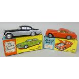 Corgi - a boxed die-cast No. 218 Aston Martin D.B.4, together with a No. 238 'By Special Request'