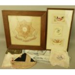 A framed East Yorkshire Regiment embroidered badge 40 x 41cm, three framed WWI souvenir