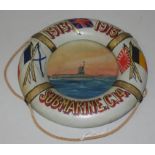 A WWI Souvenir in the form of a 21cm diameter life belt hand painted with flags, the dates 1913-1915