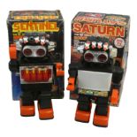 A Kamco battery operated 13" giant walking robot 'Saturn', with lites-up eyes and 4 shooting