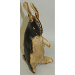 A hand stitched lucky mascot of a rabbit in black and tan leatherette