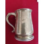 A silver baluster mug, London 1943, inscribed, weight 6.5 oz.