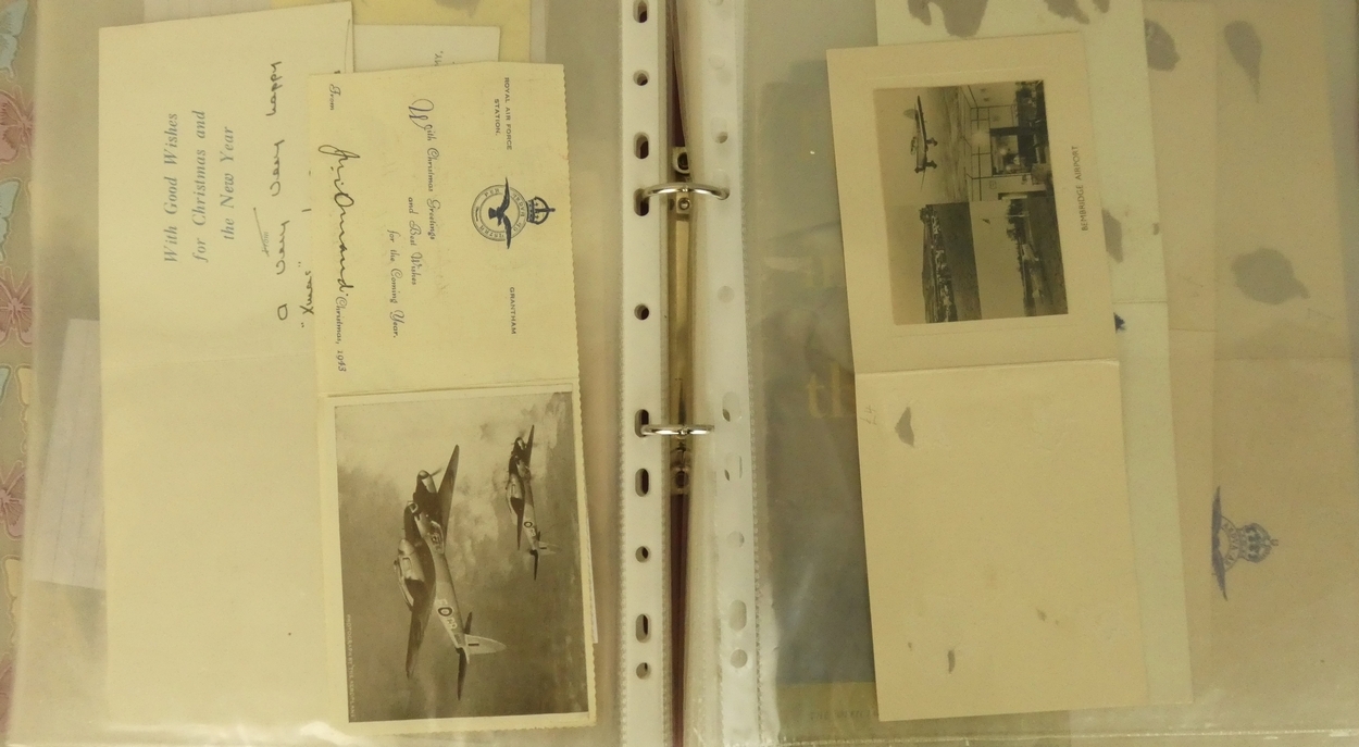 A ring binder containing twelve Christmas cards sent during WWII by well known people in the
