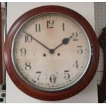 A mahogany wall clock, the 12" white dial with Arabic numerals, the movement striking the hours