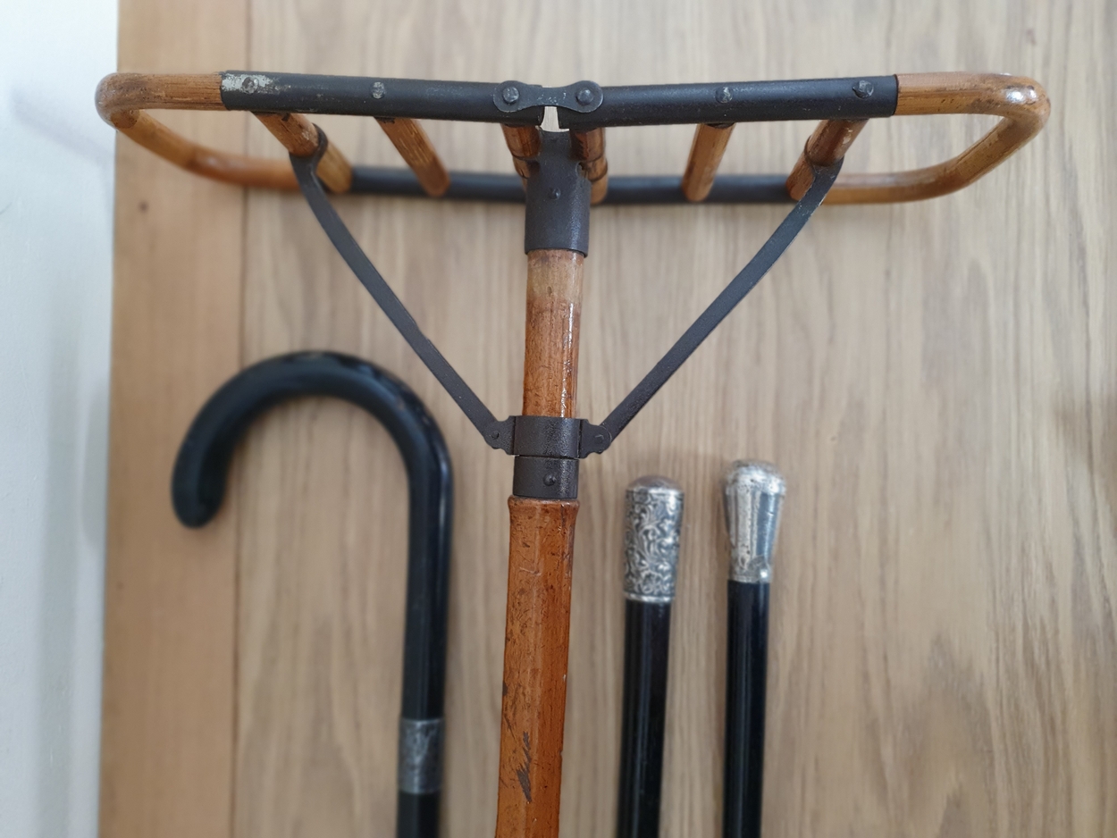 A vintage bamboo and steel shooting stick, 2 white metal mounted ebonised hardwood canes and a