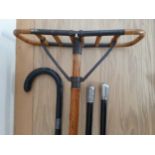 A vintage bamboo and steel shooting stick, 2 white metal mounted ebonised hardwood canes and a