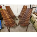 A set of four folding hardwood garden chairs.